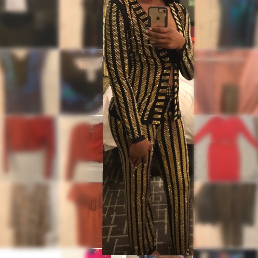 2 piece pant suit with studs. Size small.